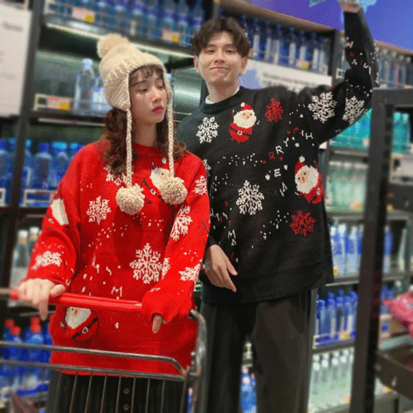 pull festif Père Noel flocons