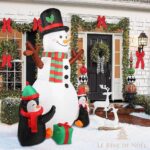 scène festive bonhomme de neige et pingouins