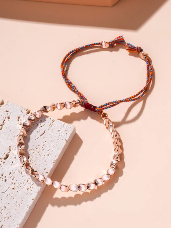 bracelet de chance en perles de cuivre rose